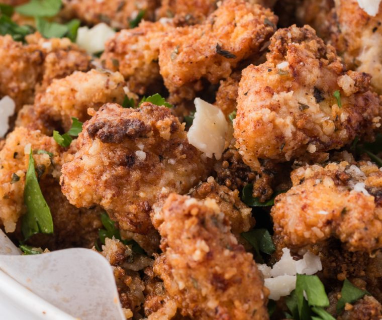 Air fryer garlic parmesan chicken bites with honey mustard dipping sauce on the side