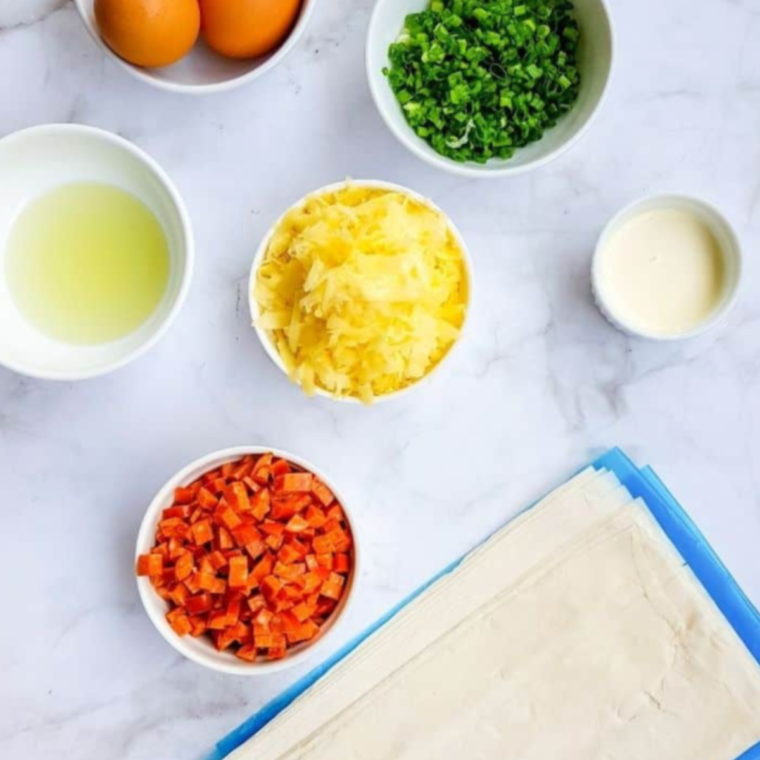 Ingredients needed for Air Fryer Muffin Tin Mini Quiche on kitchen table.