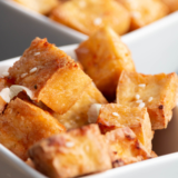 Close-up of crispy Air Fryer Salt and Pepper Tofu on a serving platter.