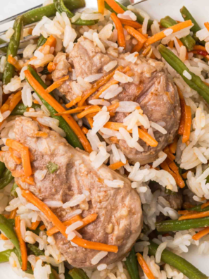 Juicy Air Fryer Teriyaki Pork Chops served on a plate with sesame seeds and green onions