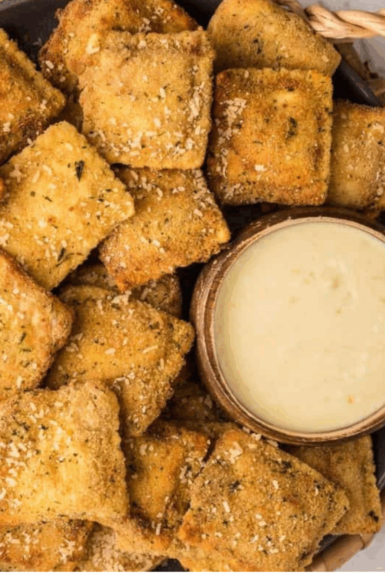Creamy Alfredo Dipping Sauce with Parmesan and garlic, perfect for dipping breadsticks and fresh veggies.