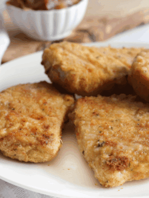 Cracker Barrel Country Fried Pork Chops with crispy breading and creamy gravy.