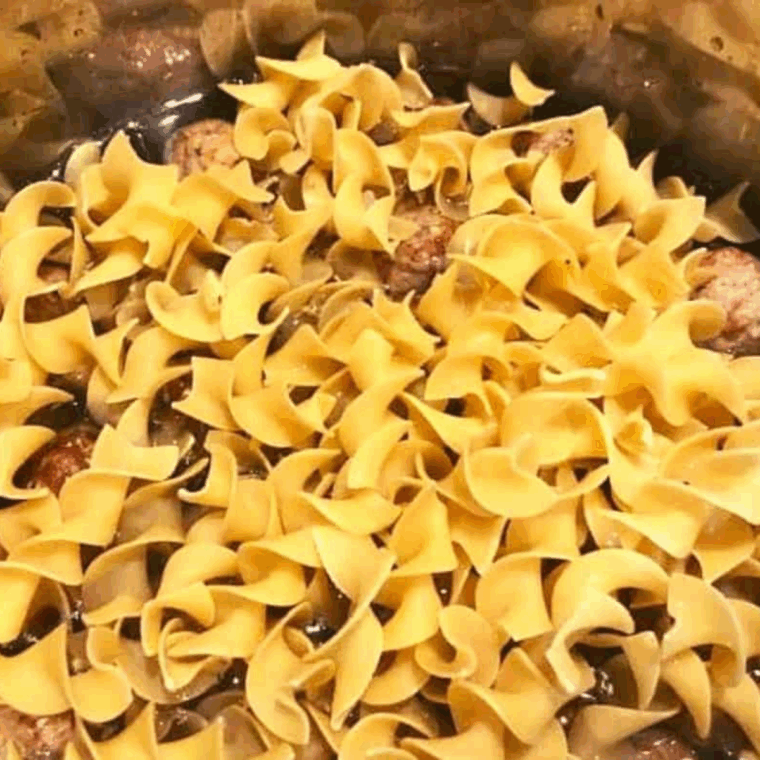 Frozen meatballs in the Instant Pot with broth, Worcestershire, garlic, Italian seasoning, salt, and pepper.