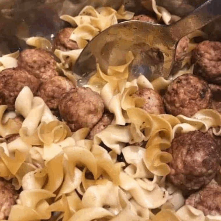 Egg noodles added on top, Instant Pot sealed, cooking under high pressure, then stirred after quick release.