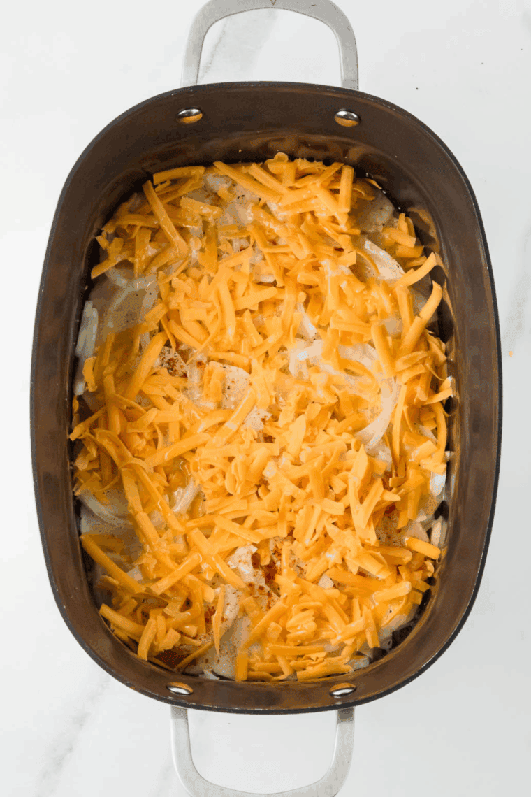 Crockpot covered and cooking potatoes on low until tender and bubbly