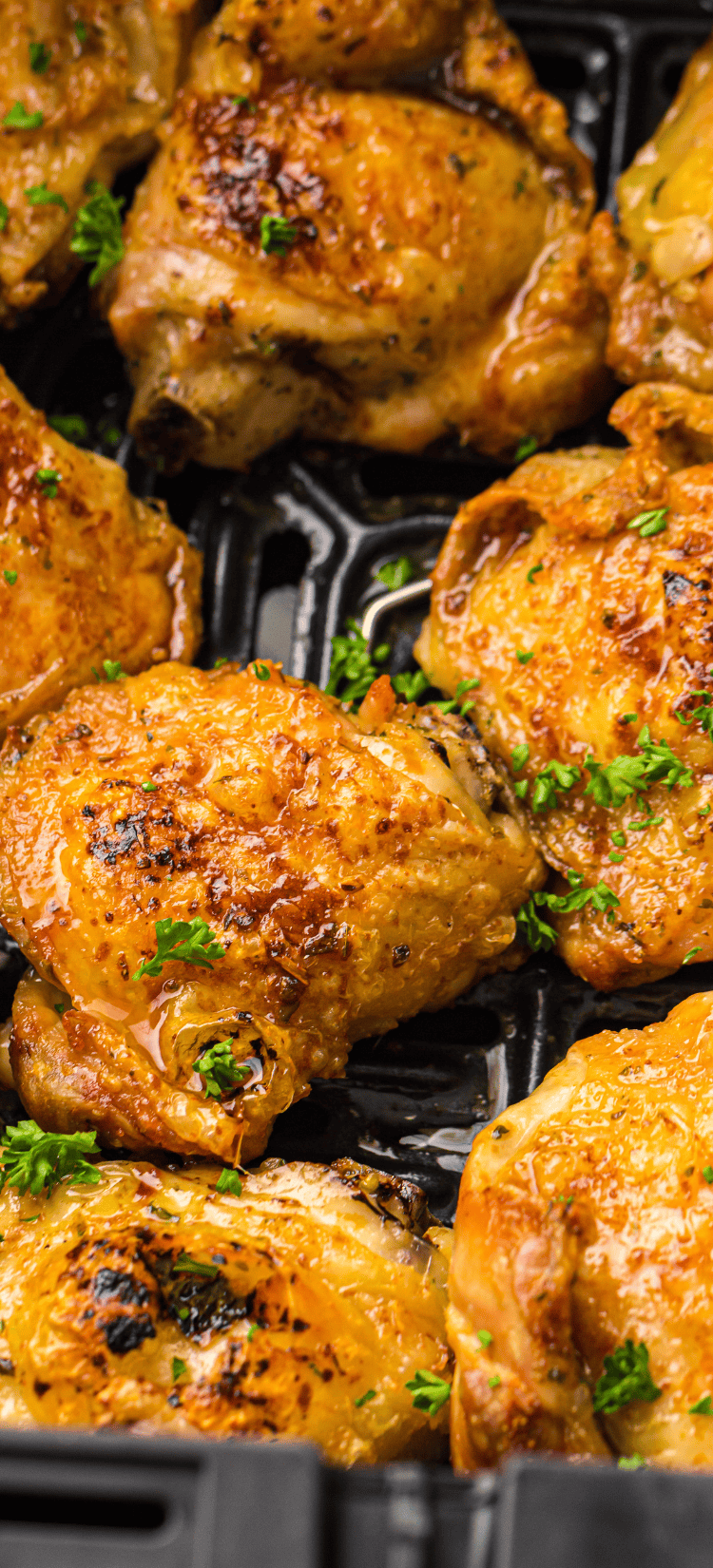 Smoky, crispy air fryer chicken thighs served golden brown and juicy, with a flavorful seasoning blend for a perfect meal.