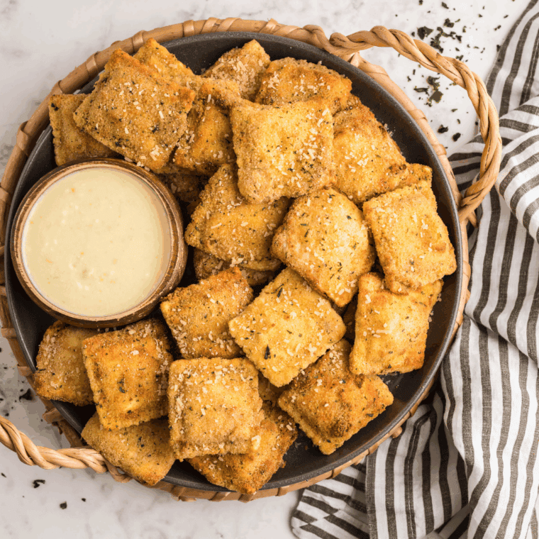 Velvety, creamy Alfredo Dipping Sauce served with breadsticks for a rich, cheesy dipping experience.
