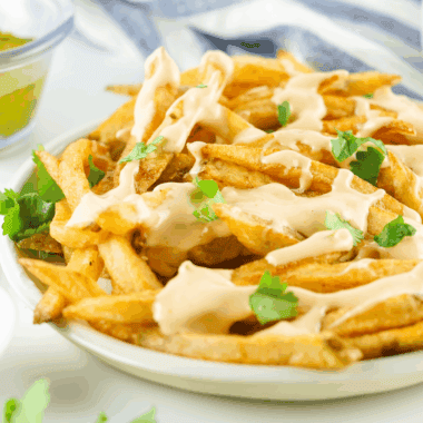 In-N-Out Animal Style Fries copycat topped with melted cheese, grilled onions, and spread over golden crispy fries.