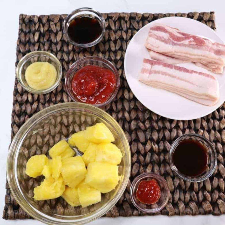 Ingredients needed for Air Fryer Bacon Wrapped Pineapples on table.