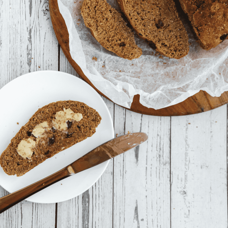 Sliced air fryer Boston brown bread with raisins, served on a cutting board