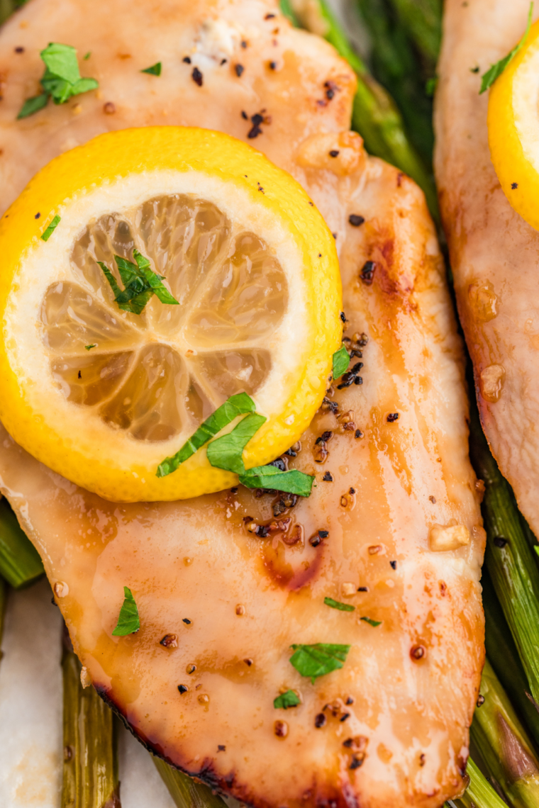 Air Fryer Chicken and Asparagus arranged on a plate, showcasing crispy chicken and vibrant, roasted asparagus.