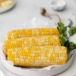 air fryer corn on the cob on a white table