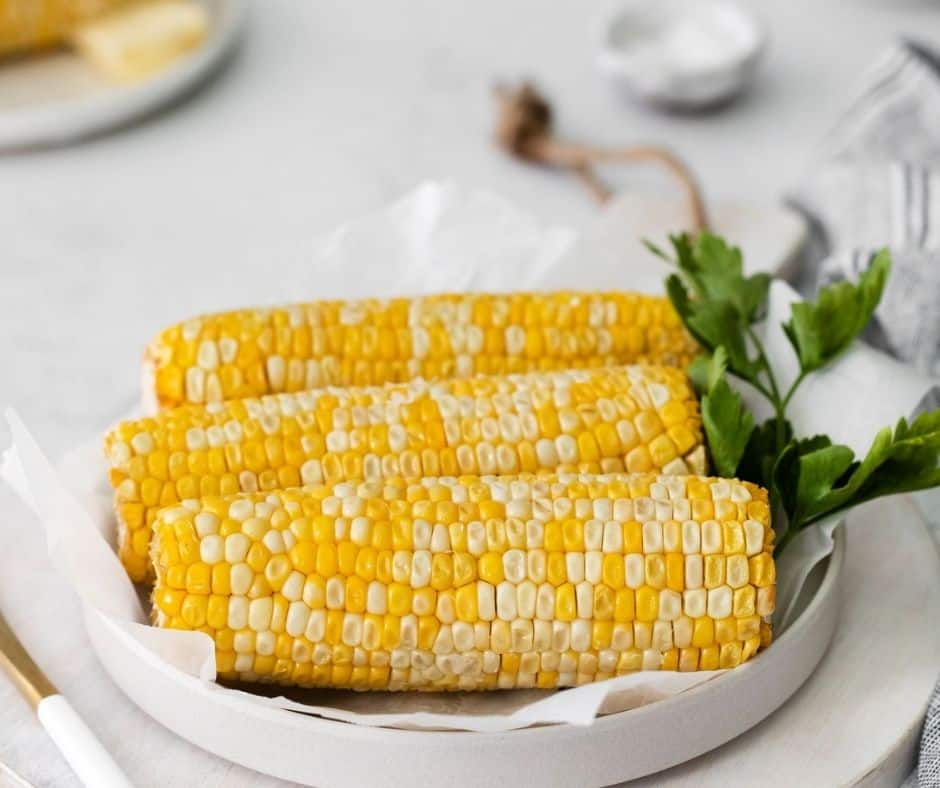 air fryer corn on the cob on a white table