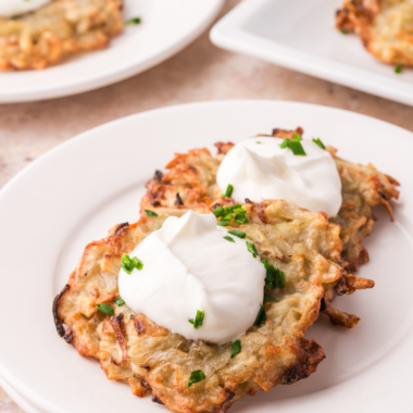 Golden, shatteringly crispy potato latkes with a fluffy center &mdash; no pot of splattering oil required. The moisture secret makes all the difference.