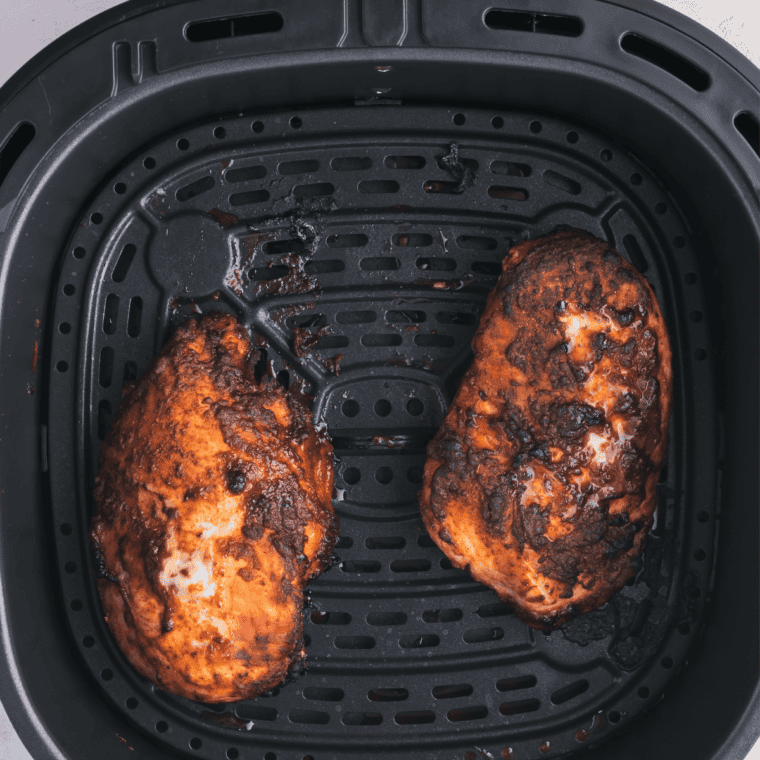 Chicken breasts cooking in the air fryer at 370 degrees for shredded chicken