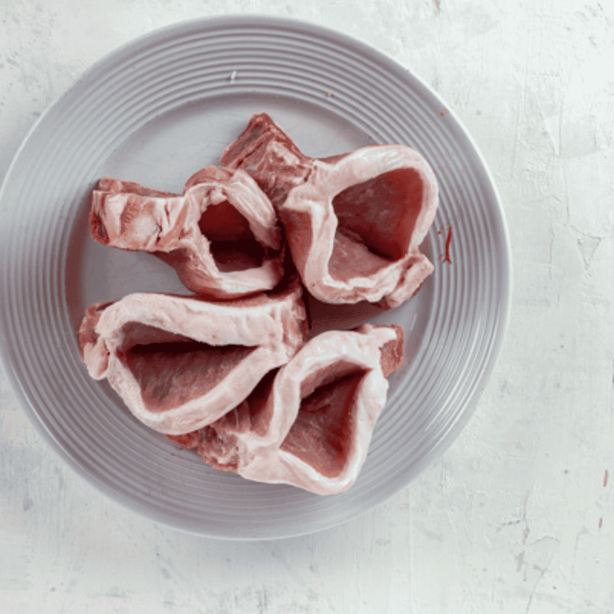 Make a horizontal cut in each thick, boneless pork chop to create a pocket for stuffing, being careful not to cut all the way through.