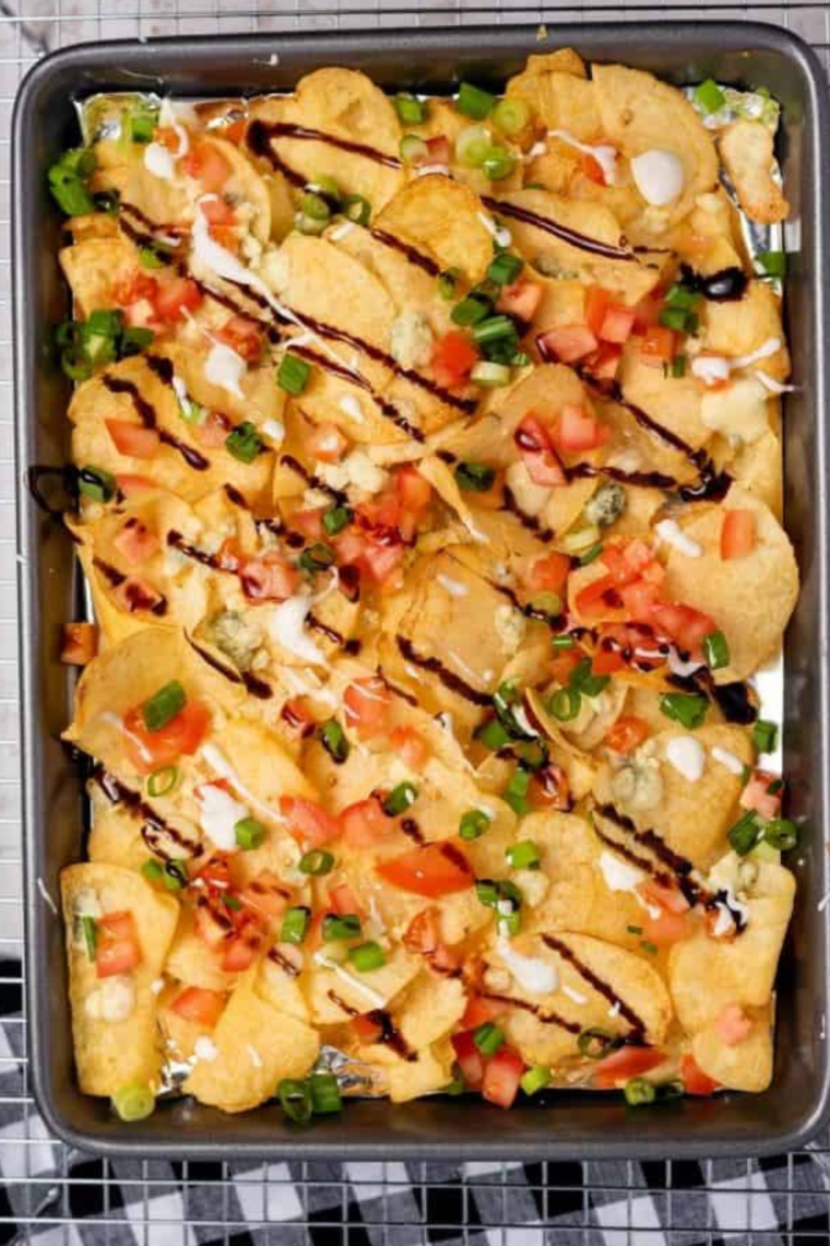 Air Fryer Ultimate Potato Chip Nachos: A delicious plate of loaded nachos made with crispy potato chips, melted cheese, and assorted toppings.