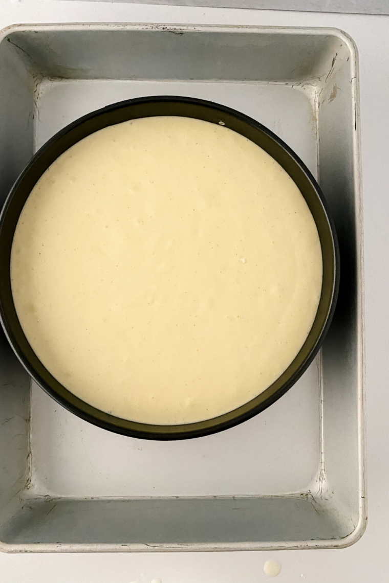 Springform pan set in roasting pan water bath for even baking