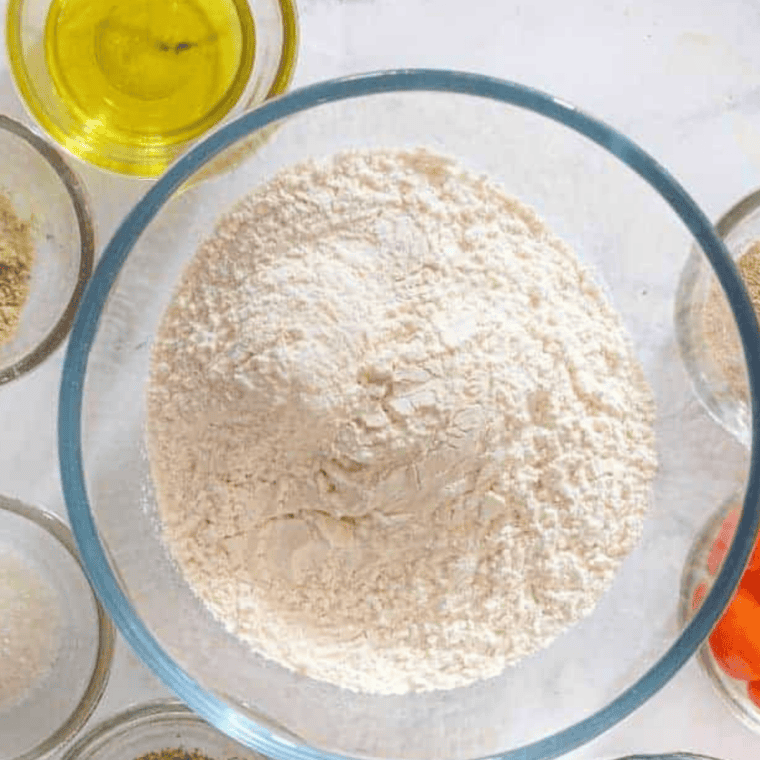 Breading station setup with flour, beaten eggs, and seasoned panko for soft shell crab