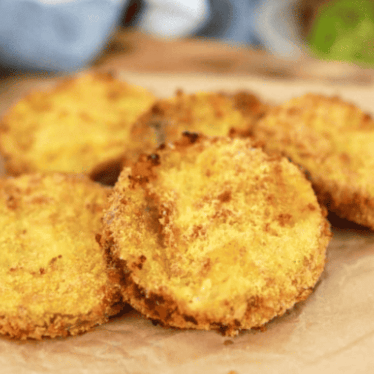 Crispy and golden Longhorn Steakhouse Fried Green Tomatoes served with a creamy dipping sauce.