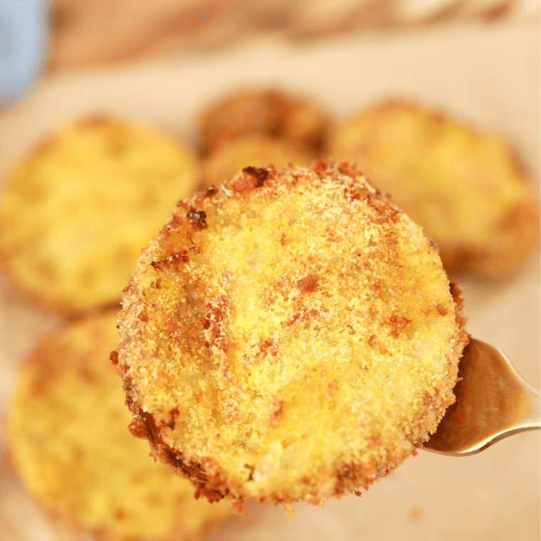 Crispy Longhorn Steakhouse Fried Green Tomatoes served with a creamy dipping sauce.