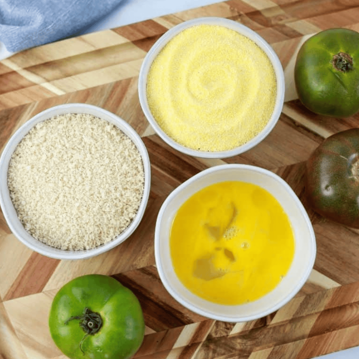 Ingredients needed for Longhorn Steakhouse Fried Green Tomatoes Recipe on kitchen table.