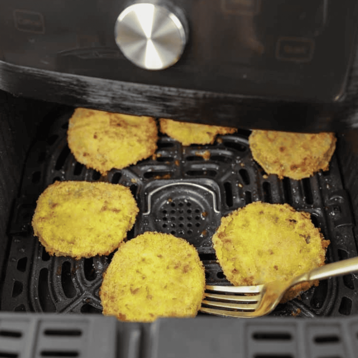 Close-up of golden-brown Air Fryer Fried Green Tomatoes.