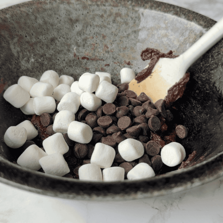 Cookie dough resting in the refrigerator to firm up before baking.