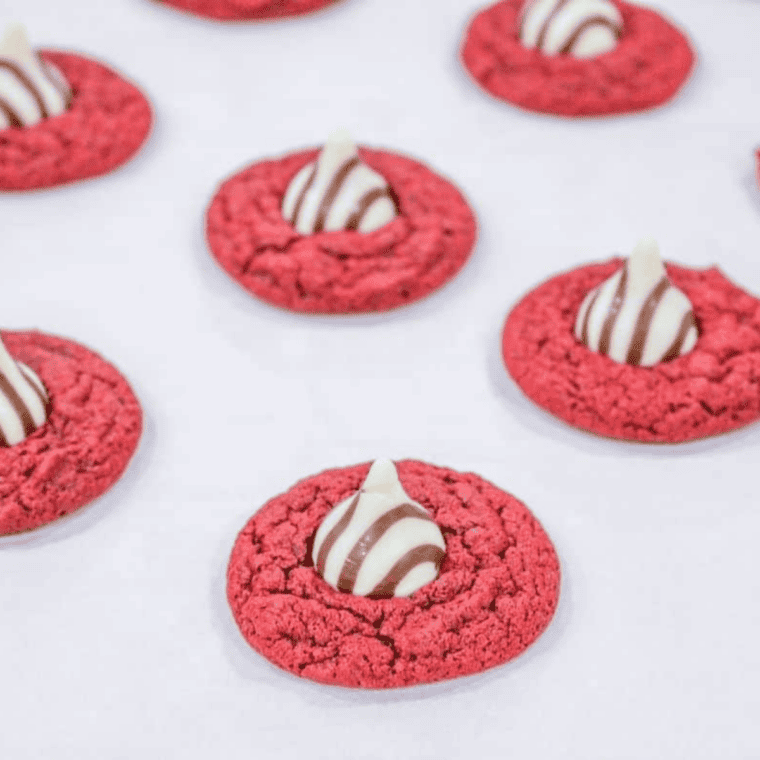 Air Fryer red velvet blossom cookies with Hershey&rsquo;s chocolate kisses on top.