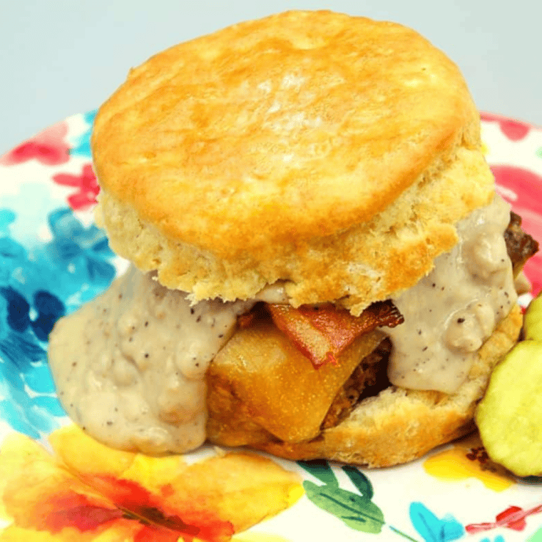 Air fryer chicken and gravy biscuit sandwich with crispy chicken, fluffy biscuits, and savory gravy.