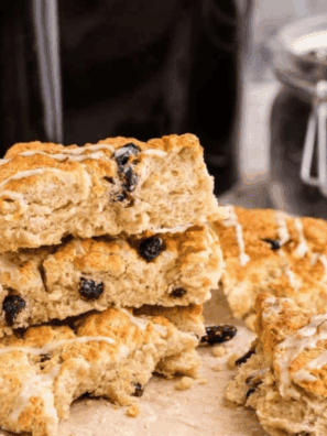 Air fryer cinnamon raisin scones golden-brown, flaky, and studded with plump raisins.