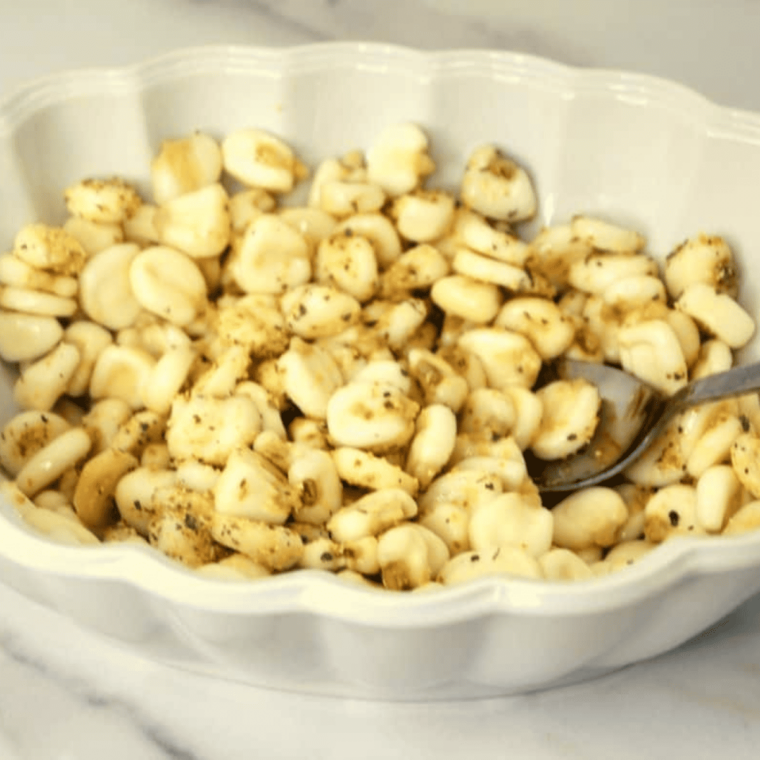 Testing corn nuts after cooking by cooling briefly and checking center texture before adding extra air fryer time if needed