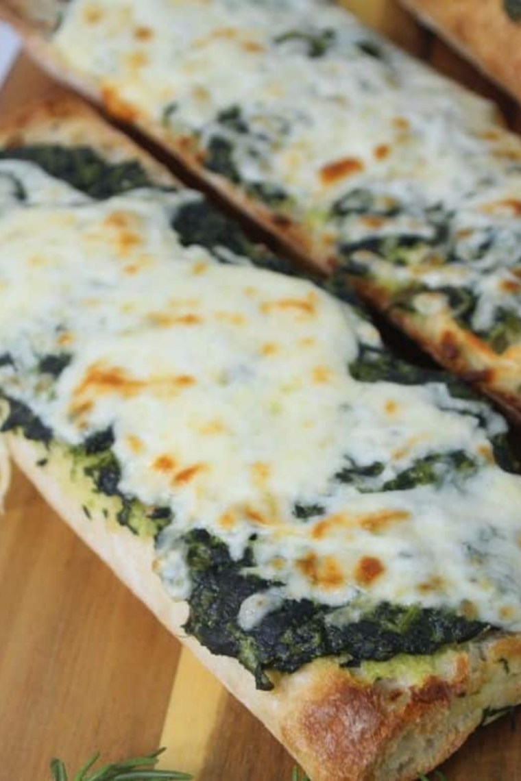 Crispy Air Fryer Spinach Florentine Pizza with melted mozzarella on toasted baguette