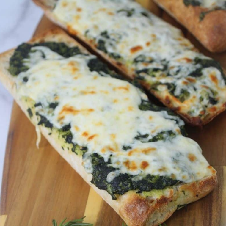 Air Fryer Spinach Florentine Pizza is a quick, easy, and delicious appetizer or snack. Crispy baguette topped with creamy spinach and melted mozzarella, ready in minutes!