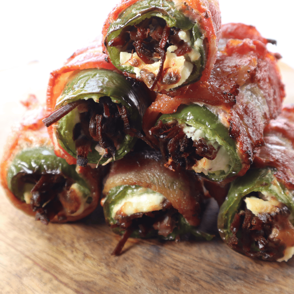 Crispy bacon-wrapped Air Fryer Texas Twinkies stuffed with brisket and cheese, served hot from the air fryer.