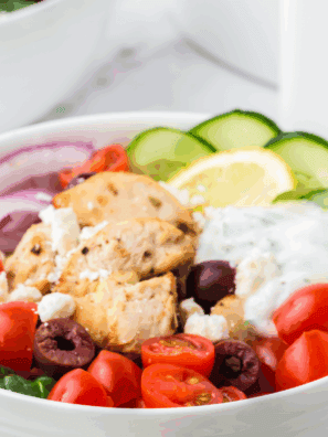 Small bowl of creamy homemade Arby’s Tzatziki Sauce garnished with fresh dill and cucumber slices