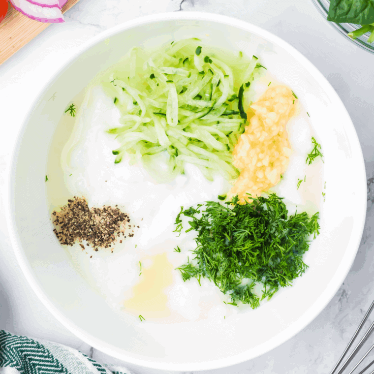 Mix all of the ingredients for Arby’s Tzatziki Sauce in a large mixing bowl.