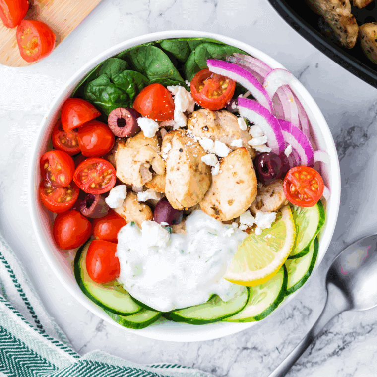 Bowl of creamy homemade Arby’s Tzatziki Sauce garnished with fresh dill and cucumber slices