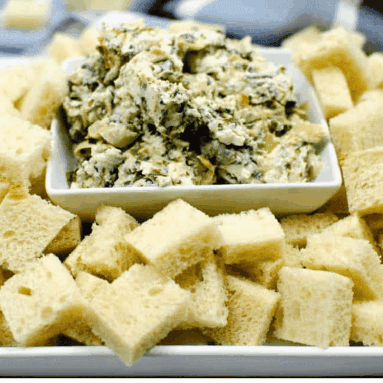 A creamy bowl of Instant Pot Copycat Applebee’s Spinach and Artichoke Dip, ready to be served with chips or bread for dipping.