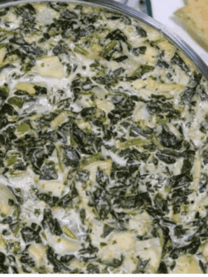 A bowl of creamy Instant Pot Copycat Applebee’s Spinach and Artichoke Dip, ready to serve with chips or bread for dipping.