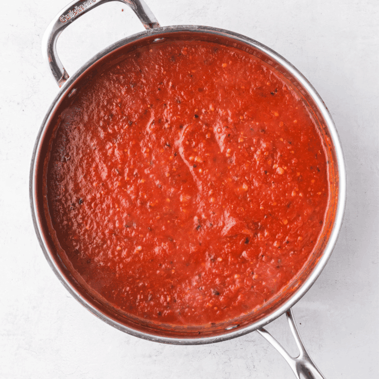 Simmer sauce over low heat for 20–30 minutes, stirring occasionally to thicken and blend flavors.