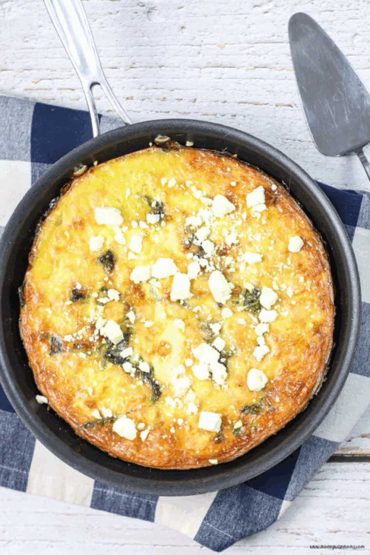 Golden asparagus, spinach, and cheese frittata cooked in an air fryer, ready to serve.