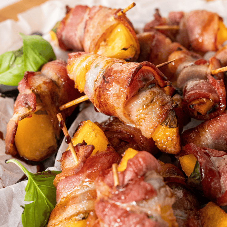 Air Fryer Bacon Wrapped Peaches with crispy bacon and tender peach slices, served as a sweet and savory snacks.