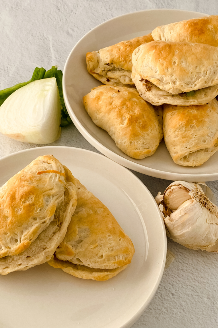 Golden brown air fryer cheesesteak empanadas ready to serve