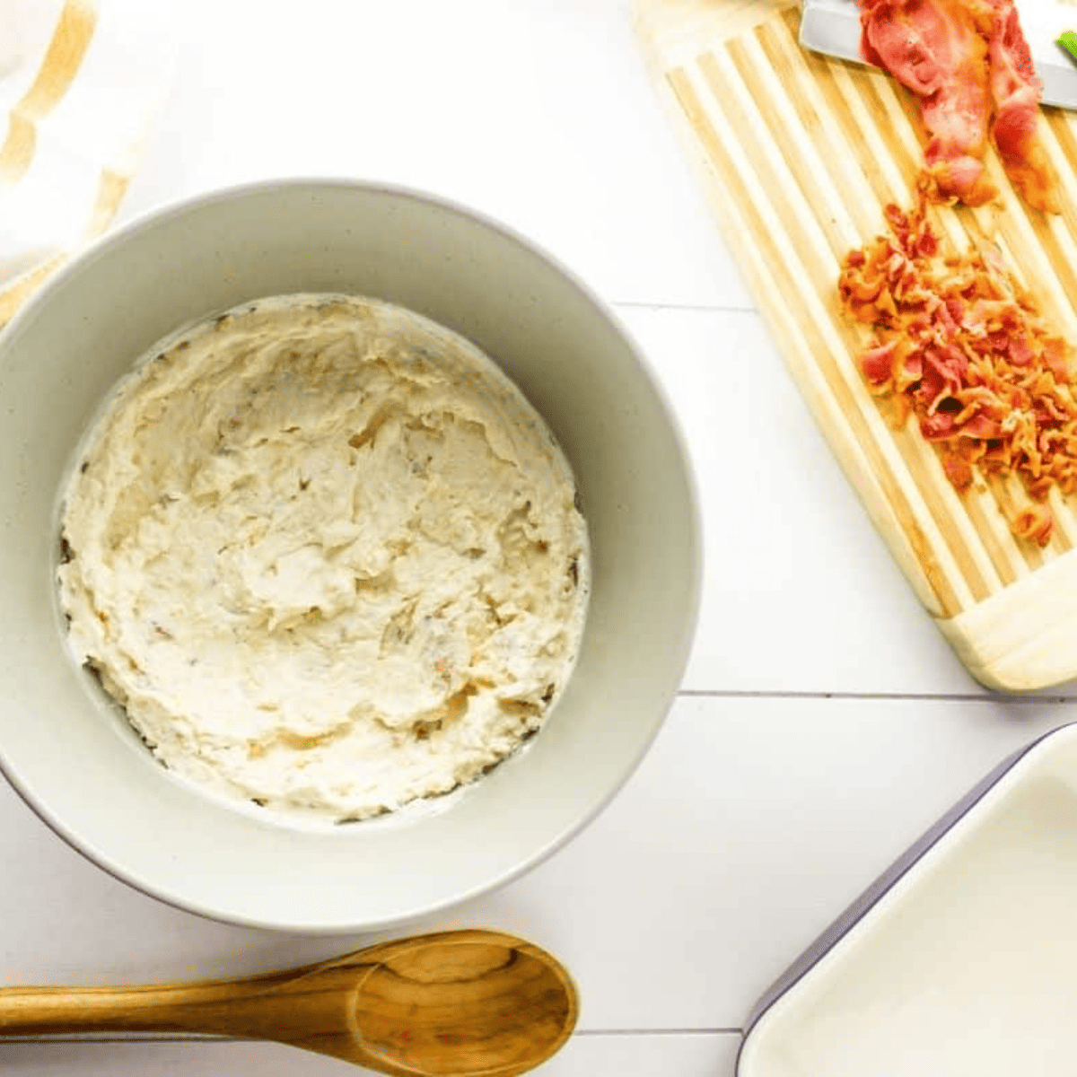 Combining the cottage cheese dip ingredients in a large mixing bowl.