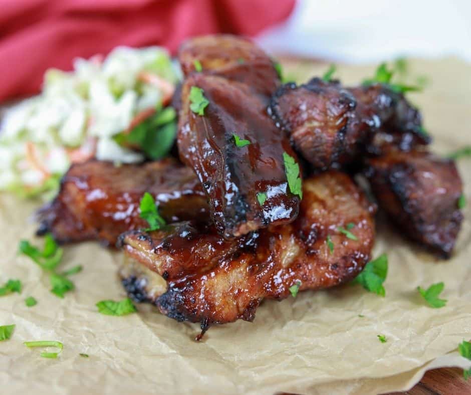 Air Fryer Country Style Ribs on top of parchment paper. 