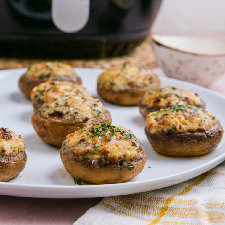 Place stuffed mushrooms on a plate for serving.