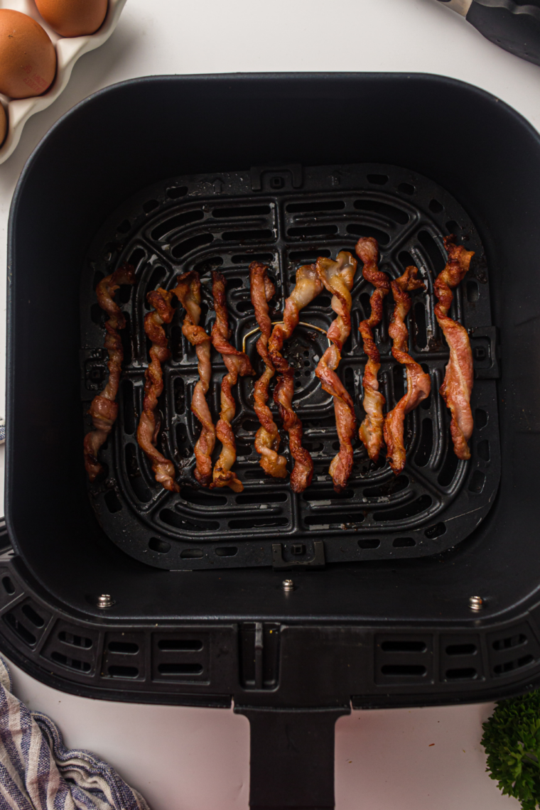 Air fryer twisted bacon spirals cooked until crispy, golden, and caramelized for a viral TikTok-style bacon hack that improves texture and crunch