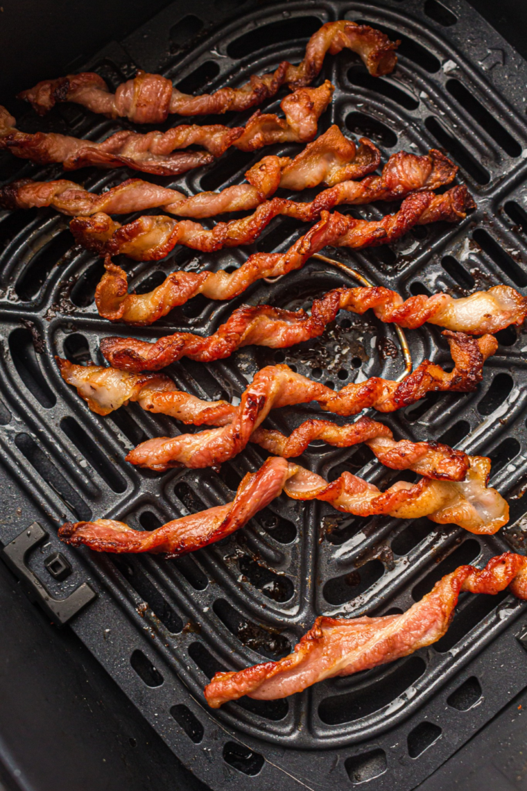 Close-up of Air Fryer Twisted Candied Bacon served on a white plate, highlighting the crispy texture and rich, sweet coating.