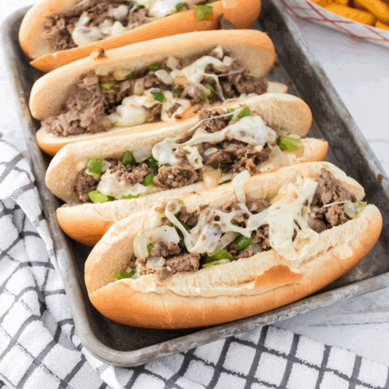 Homemade Arby’s Angus Cheesesteak sandwich with provolone cheese and sautéed peppers on a toasted hoagie roll.
